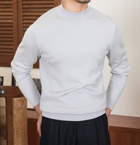 Pullover aus Wollmischung mit Stehkragen und schmalem Schnitt