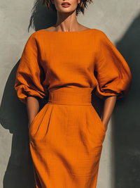 Set aus orangefarbenem Mid-Arm-Oberteil und Midirock