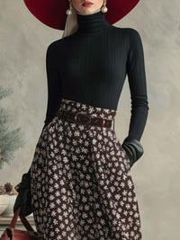 Elegantes Retro-Set mit schwarzem Rollkragenoberteil und braunem Rock mit Schneeflockenmuster im modernen Stil