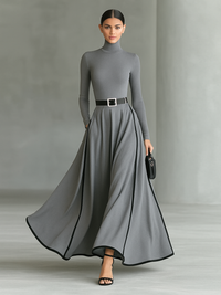 Maxikleid mit hohem Kragen, langen Ärmeln, schwarzer Naht, weißem Besatz und engem Gürtel