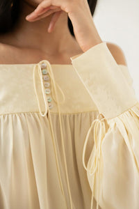 Cremiges Schulterfrei-Kleid