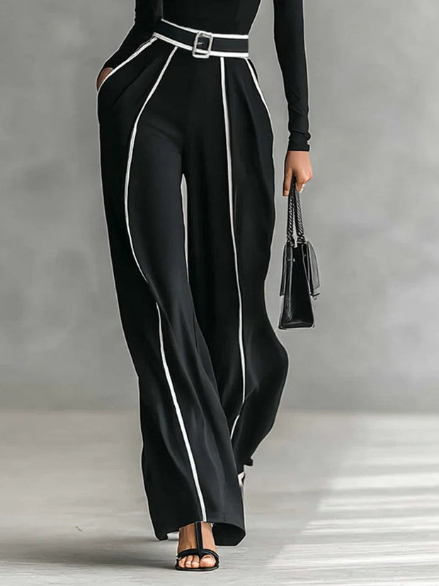 Weißes Oberteil mit hohem Kragen und langen Ärmeln, kombiniert mit weitem Hosenbein und Gürtel-Set im modernen Stil
