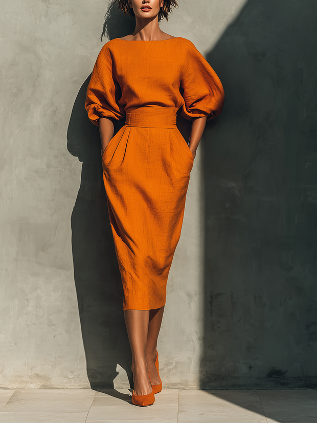 Set aus orangefarbenem Mid-Arm-Oberteil und Midirock