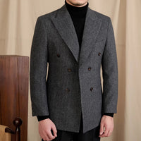 Jacke aus Wollmischung mit Fischgrätmuster, doppelreihigem Schnitt und Spitzrevers