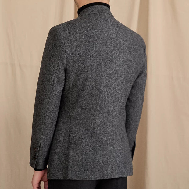 Jacke aus Wollmischung mit Fischgrätmuster, doppelreihigem Schnitt und Spitzrevers